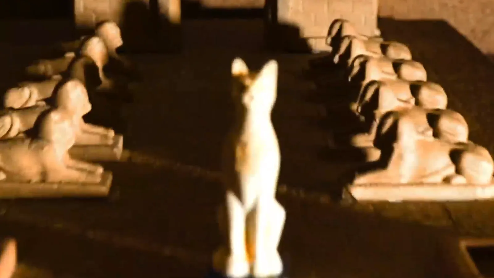 A row of stone sphinxes lit from below inside Lost Tomb, the Entombed sequel